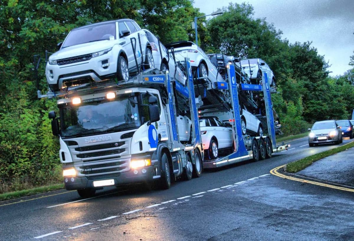 Car carrier truck transporting multiple vehicles across the country